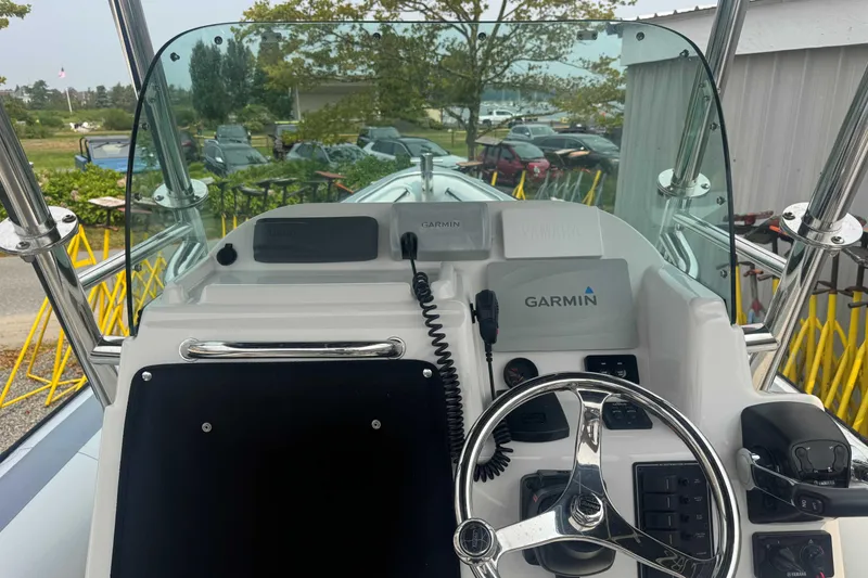 Slide: The Image of 2016 Protector 30 Center Console boat dashboard with Garmin navigation system. - 7