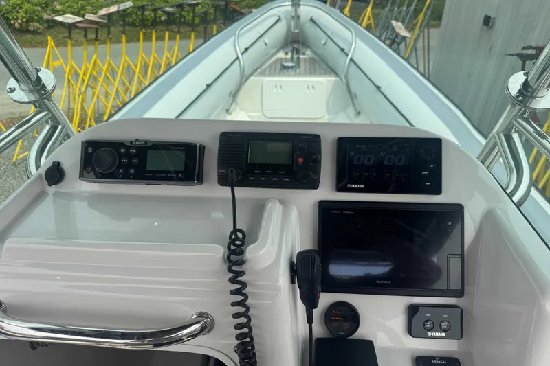 Slide: The Image of Control panel of a 2016 Protector 30 Center Console boat with navigation equipment. - 8