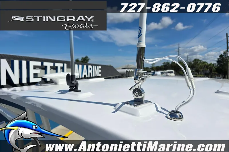 Slide: The Image of 2026 Stingray 259DC boat at Antonietti Marine dealership, featuring antenna and clear sky. - 14
