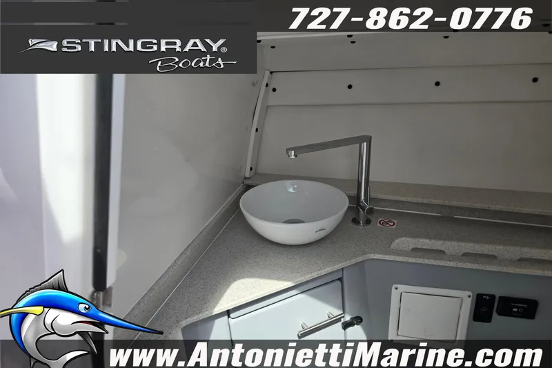 Slide: The Image of 2026 Stingray 259DC boat interior with modern sink and countertop, Antonietti Marine branding. - 32