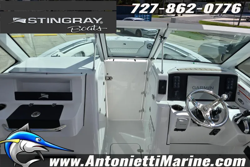 Slide: The Image of Interior view of 2026 Stingray 259DC boat with Garmin navigation system. - 34