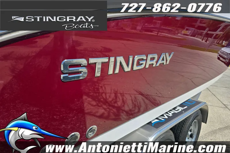 Slide: The Image of Red 2026 Stingray 259DC boat with logo, displayed at Antonietti Marine. - 4