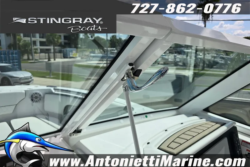 Slide: The Image of 2026 Stingray 259DC boat interior with windshield and control panel, Antonietti Marine branding. - 42