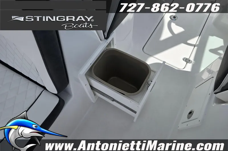 Slide: The Image of 2026 Stingray 259DC boat interior with storage compartment, featuring Antonietti Marine branding. - 51