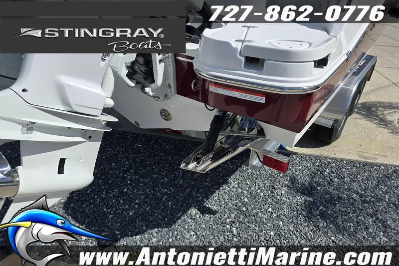 Slide: The Image of 2026 Stingray 259DC boat rear view with trailer, featuring Antonietti Marine branding. - 6