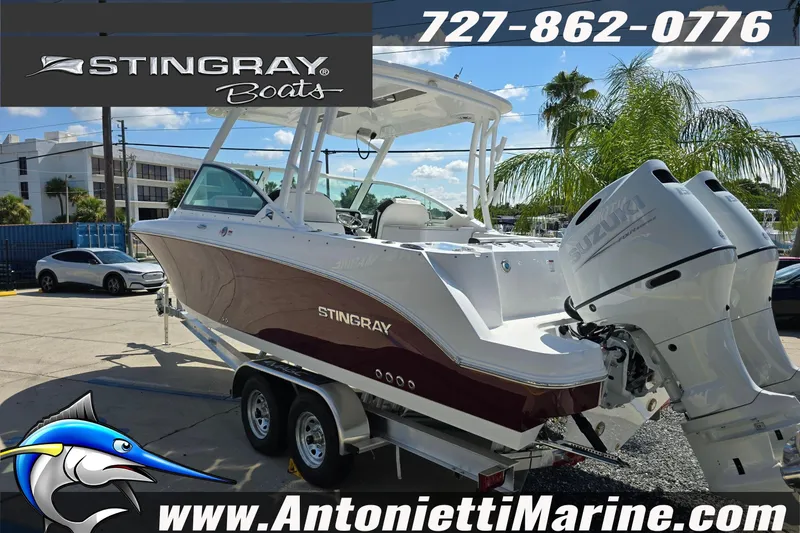 Slide: The Image of 2026 Stingray 259DC boat on trailer at Antonietti Marine dealership. - 9