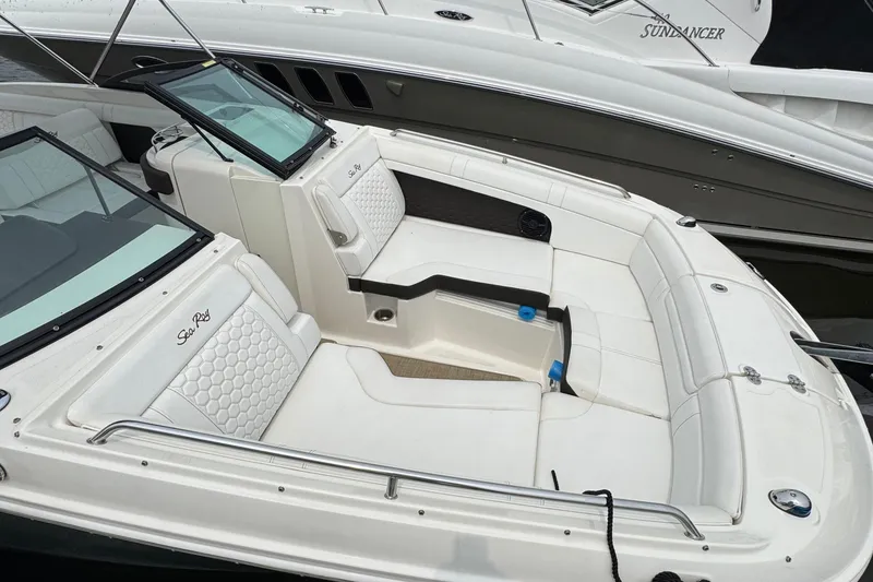 Slide: The Image of 2018 Sea Ray SDX 270 Outboard boat with spacious white seating and sleek design. - 3