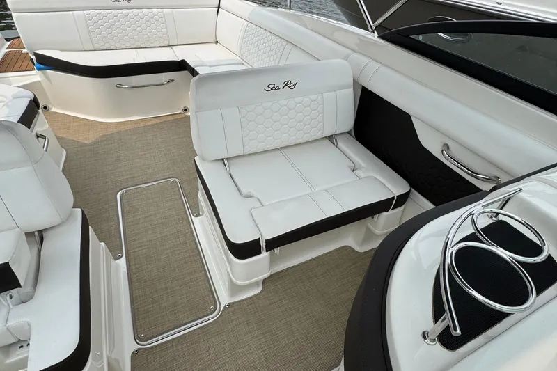 Slide: The Image of 2018 Sea Ray SDX 270 Outboard interior with white seating and elegant design. - 6