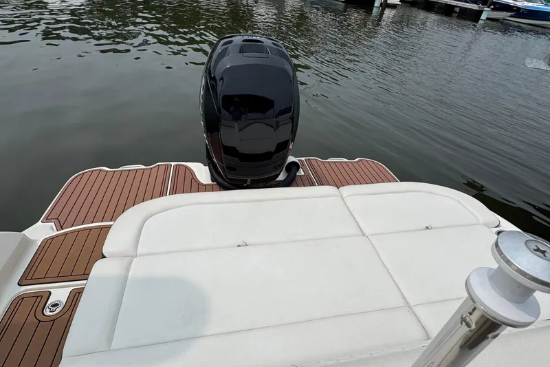 Slide: The Image of 2018 Sea Ray SDX 270 Outboard boat with sleek deck and powerful engine. - 8