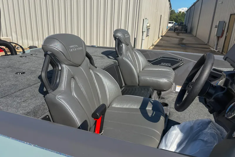 Slide: The Image of 2026 Skeeter ZXR 19 boat interior with gray seats and steering wheel. - 13