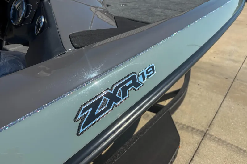 Slide: The Image of 2026 Skeeter ZXR 19 boat detail with logo on sleek exterior. - 2