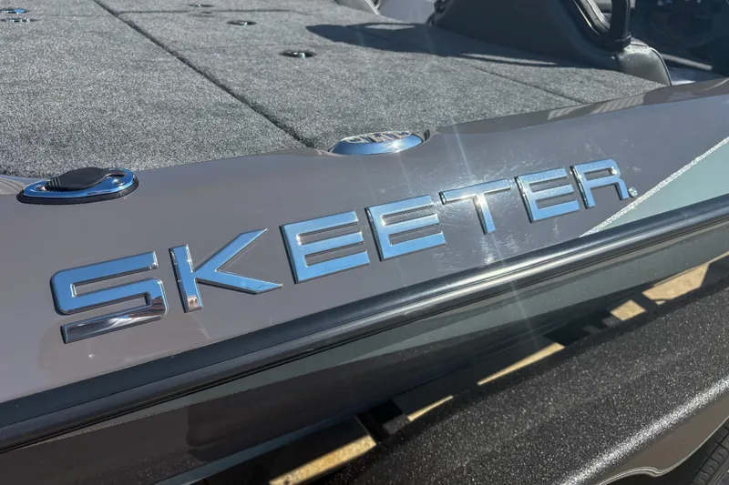 Slide: The Image of 2026 Skeeter ZXR 19 boat with sleek design and metallic logo. - 6
