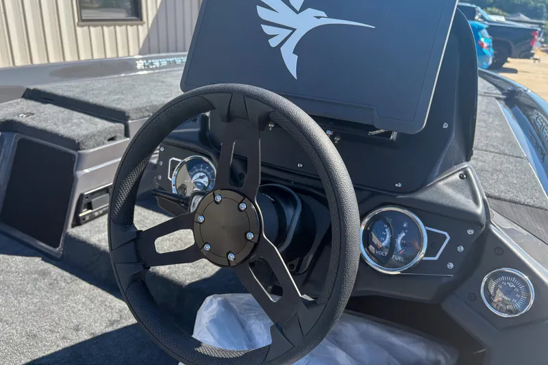 Slide: The Image of 2026 Skeeter ZXR 19 boat dashboard with steering wheel and gauges. - 7