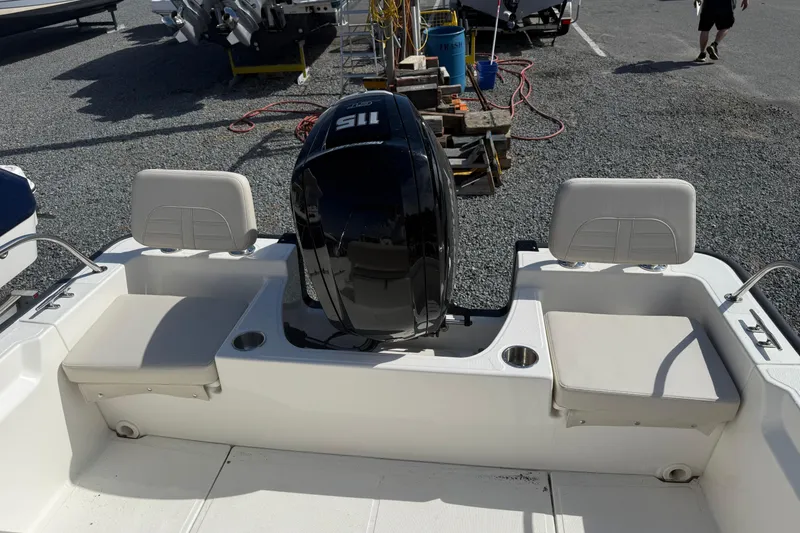 Slide: The Image of 2024 Boston Whaler 190 Montauk boat with dual seating and powerful outboard motor. - 5