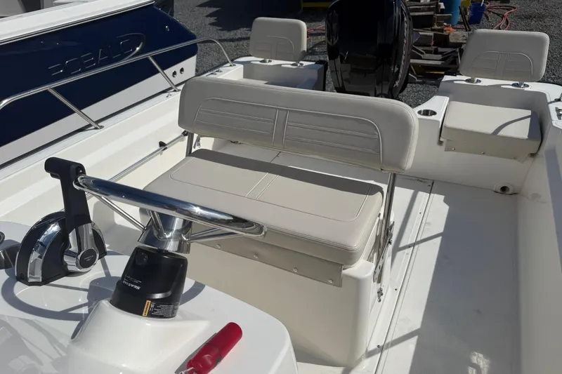 Slide: The Image of 2024 Boston Whaler 190 Montauk boat interior with steering console and seating. - 6