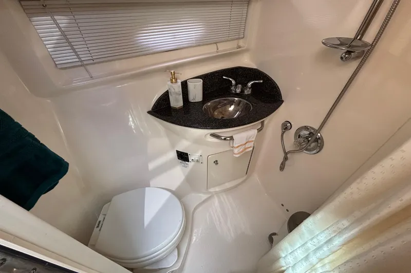 Slide: The Image of 2007 Chaparral Signature 350 bathroom with sink, toilet, and shower. - 8