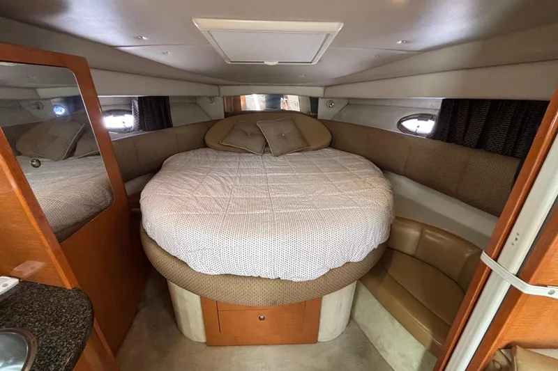 Slide: The Image of 2007 Chaparral Signature 350 cabin interior with cozy bed and seating area. - 9