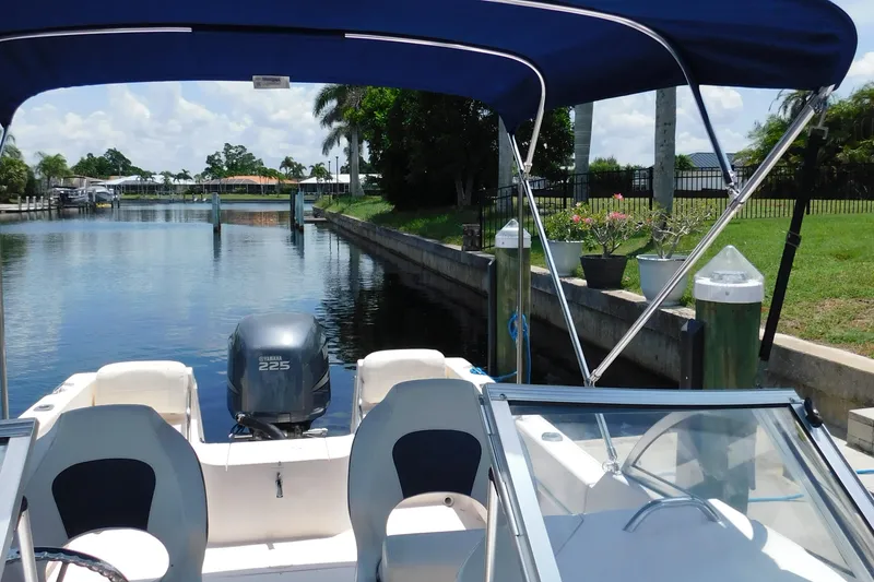 Slide: The Image of 2008 Grady-White Tournament 205 boat docked in a scenic canal setting. - 13