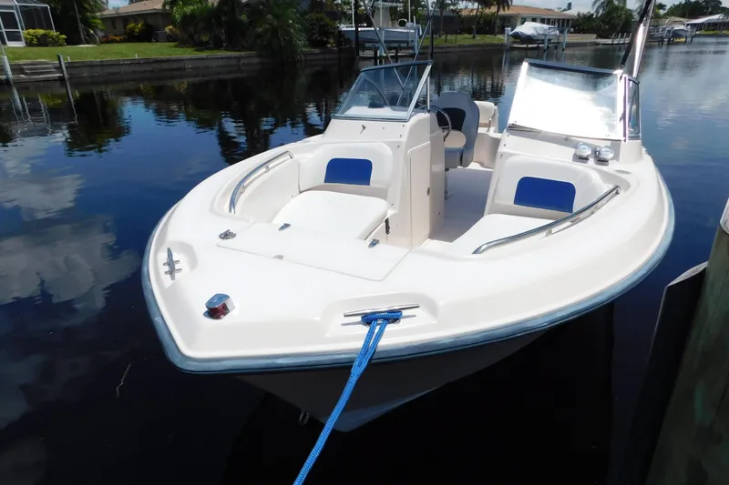 Slide: The Image of 2008 Grady-White Tournament 205 boat docked on calm water. - 3