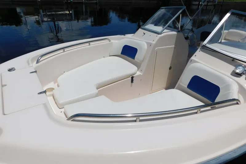 Slide: The Image of 2008 Grady-White Tournament 205 boat interior with cushioned seating and stainless steel rails. - 6