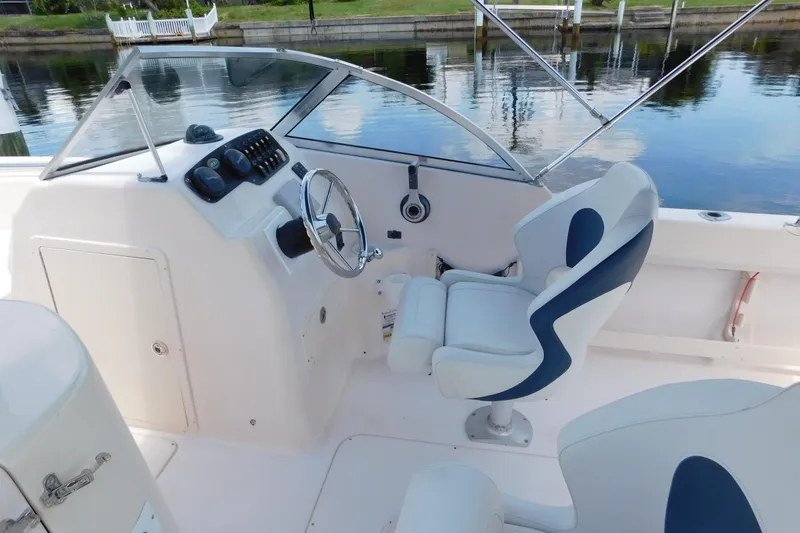 Slide: The Image of 2008 Grady-White Tournament 205 boat interior with steering wheel and seating. - 9