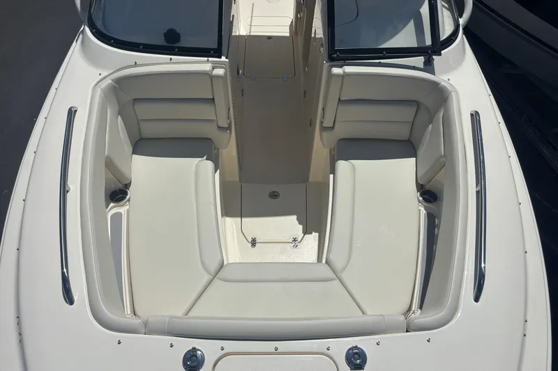 Slide: The Image of 2026 Scout 255 Dorado boat interior with spacious seating and cup holders. - 10