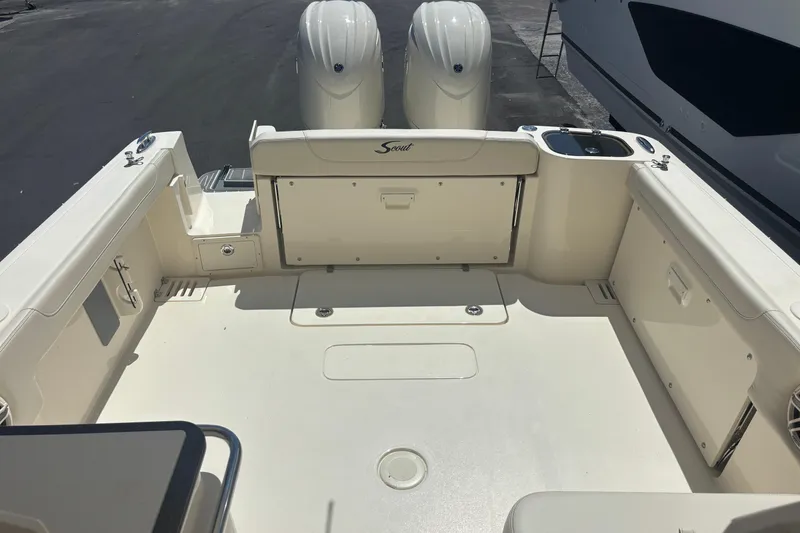 Slide: The Image of 2026 Scout 255 Dorado boat deck with dual engines and spacious seating area. - 23