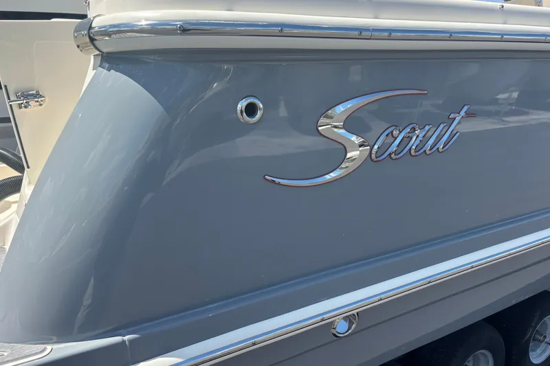 Slide: The Image of 2026 Scout 255 Dorado boat with sleek gray exterior and chrome accents. - 31