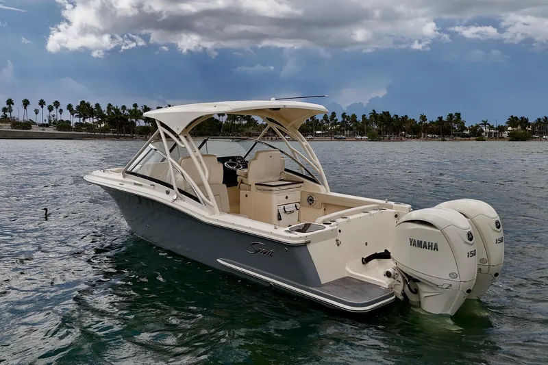 Slide: The Image of 2026 Scout 255 Dorado boat with Yamaha engines on a scenic waterway. - 4