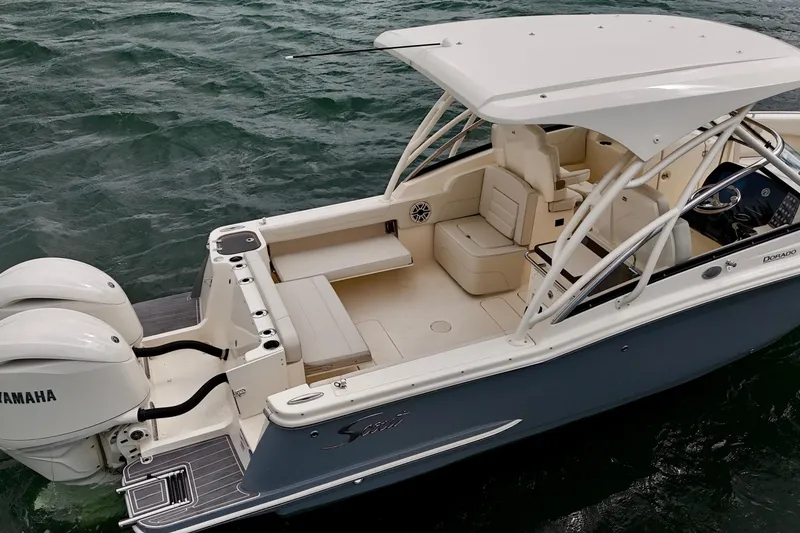 Slide: The Image of 2026 Scout 255 Dorado boat with Yamaha engines on water. - 7