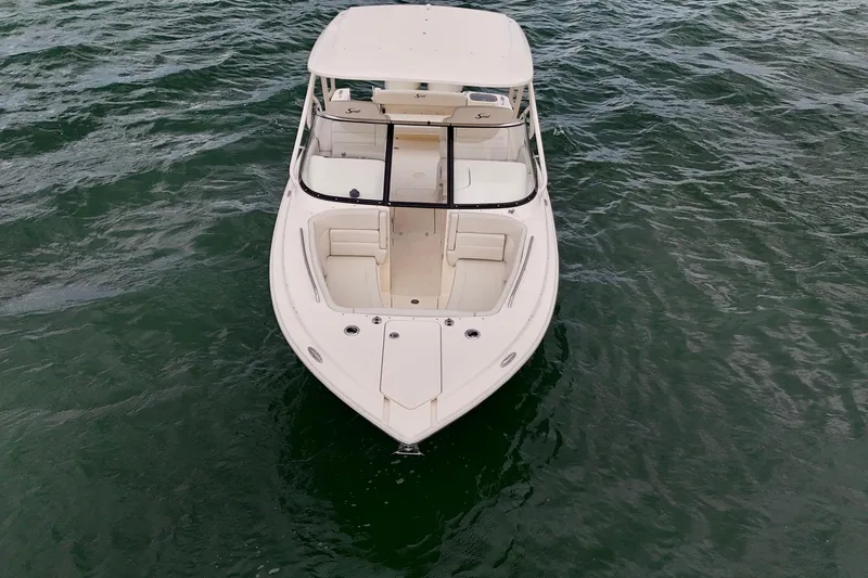 Slide: The Image of 2026 Scout 255 Dorado boat on water, aerial view. - 8