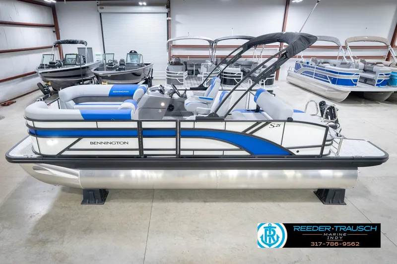 The Image of 2026 Bennington 21 SSB pontoon boat in showroom, featuring sleek design and modern amenities. - 0