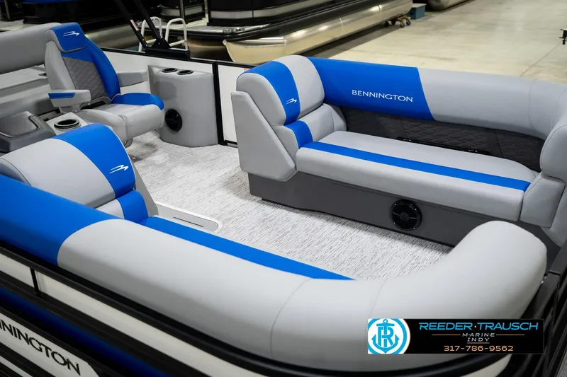 Slide: The Image of 2026 Bennington 21 SSB pontoon boat interior with blue and gray seating. - 12