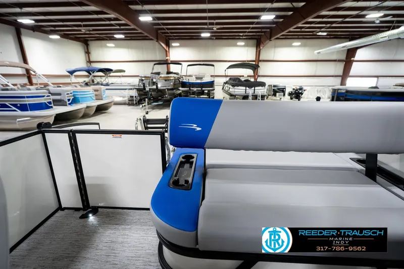 Slide: The Image of 2026 Bennington 21 SSB pontoon boat interior with blue and gray seating. - 17