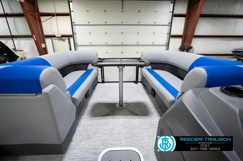 Slide: The Image of Interior of 2026 Bennington 21 SSB pontoon boat with blue and gray seating. - 21