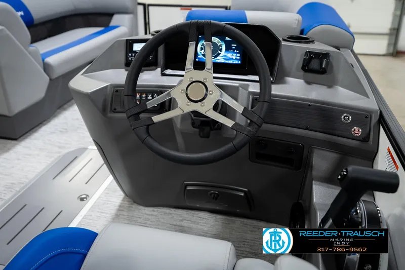 Slide: The Image of 2026 Bennington 21 SSB boat dashboard with steering wheel and control panel. - 29