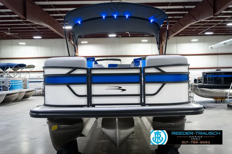 Slide: The Image of 2026 Bennington 21 SSB pontoon boat with canopy in showroom. - 4