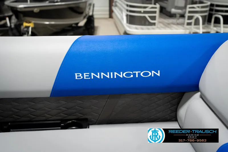 Slide: The Image of 2026 Bennington 21 SSB boat interior with blue and gray seating at Reeder-Trausch Marine. - 40