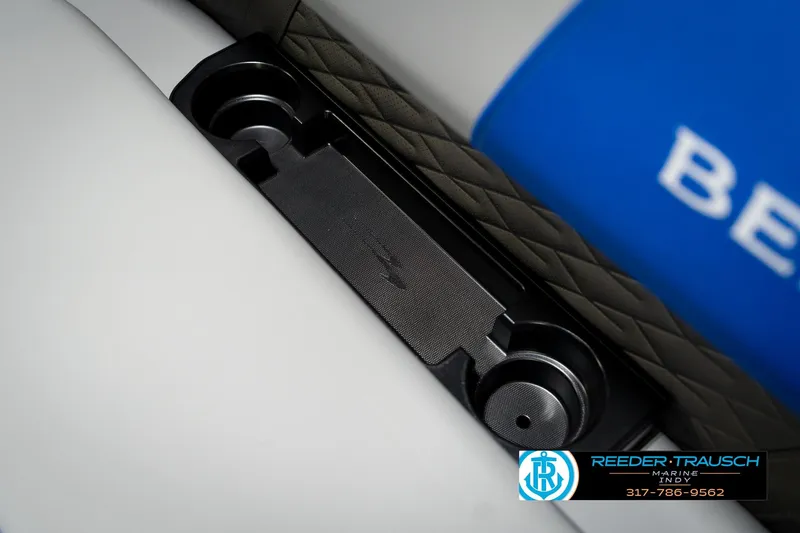 Slide: The Image of 2026 Bennington 21 SSB boat cup holder detail with Reeder-Trausch Marine logo. - 42