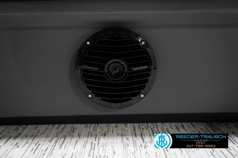 Slide: The Image of 2026 Bennington 21 SSB interior with blue and gray seating, textured flooring. - 44