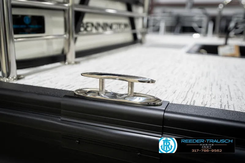 Slide: The Image of 2026 Bennington 21 SSB capacity label: 11 persons, 1593 lbs, 150 HP motor compliance. - 52