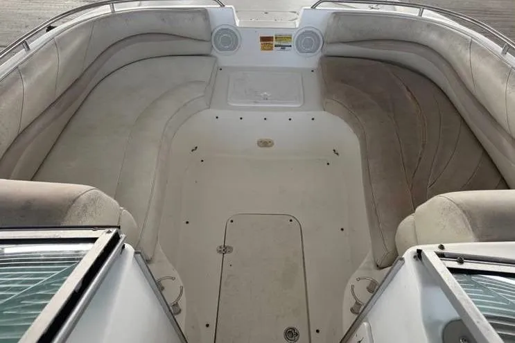 Slide: The Image of 2006 NauticStar 210 DC Sport Deck boat interior with spacious seating and storage. - 10