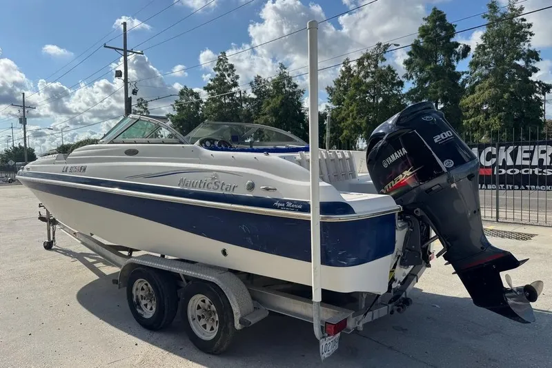 Slide: The Image of 2006 NauticStar 210 DC Sport Deck boat on trailer with Yamaha 200 engine. - 5