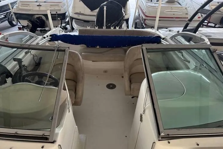 Slide: The Image of 2006 NauticStar 210 DC Sport Deck boat interior with seating and windshield. - 9