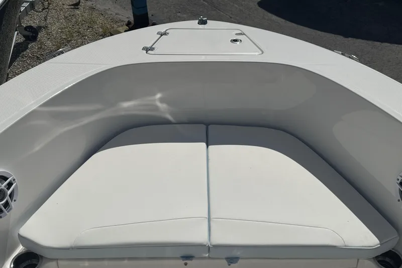 Slide: The Image of 2025 Robalo R180 Center Console boat with cushioned bow seating. - 5