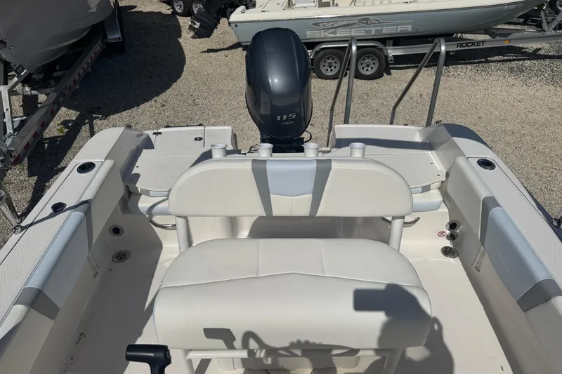 Slide: The Image of 2025 Robalo R180 Center Console boat interior with seating and outboard motor. - 7