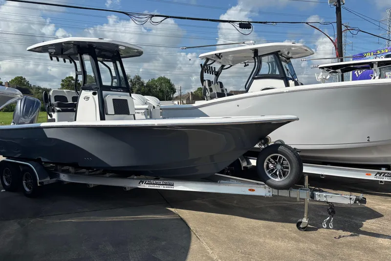 The Image of 2026 Tidewater 2500 Carolina Bay boat on trailer, parked outdoors. - 1