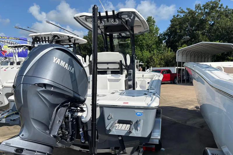 Slide: The Image of 2026 Tidewater 2500 Carolina Bay boat on trailer with Yamaha outboard motor. - 2