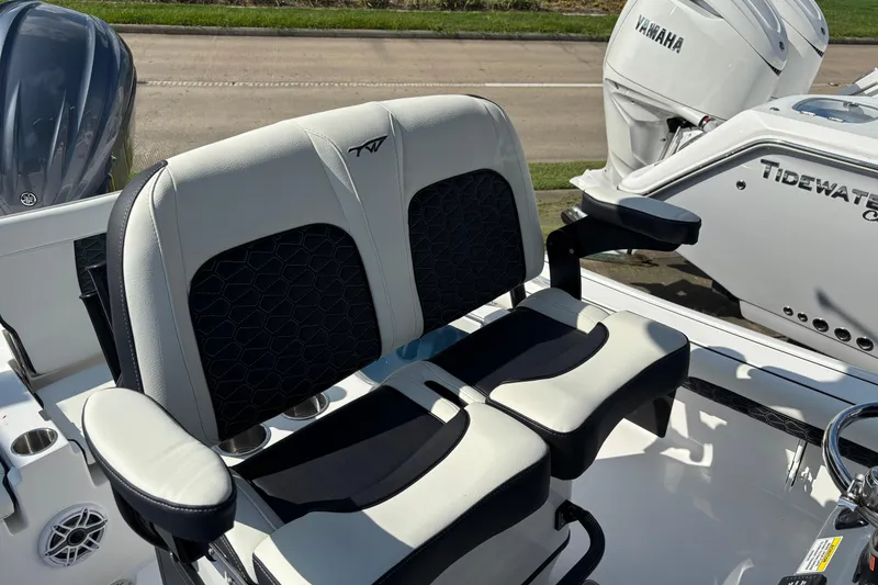 Slide: The Image of 2026 Tidewater 2500 Carolina Bay boat with Yamaha engines and comfortable seating. - 7