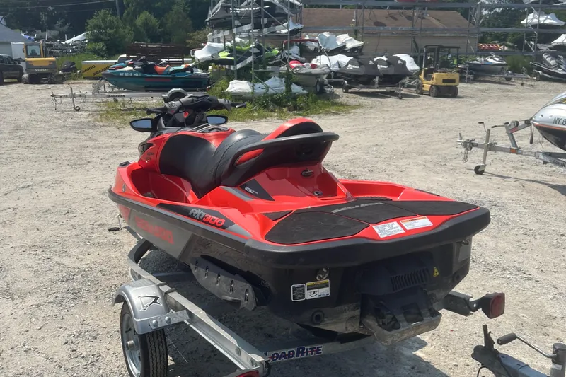 Slide: The Image of 2016 Sea-Doo RXT-X 300 jet ski on a trailer in a boatyard. - 5